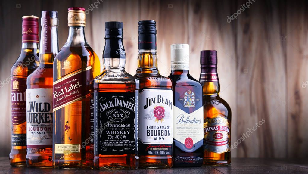 POZNAN, POLAND - JUL 5, 2019: Bottles of several global whiskey brands, the most popular liquor in the world.