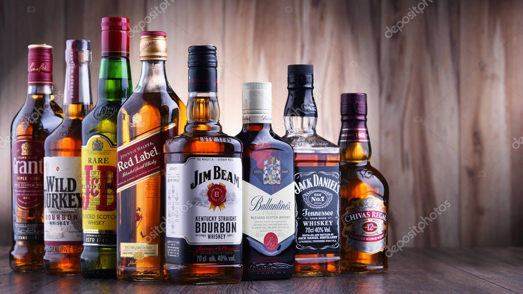 POZNAN, POLAND - JUL 5, 2019: Bottles of several global whiskey brands, the most popular liquor in the world.