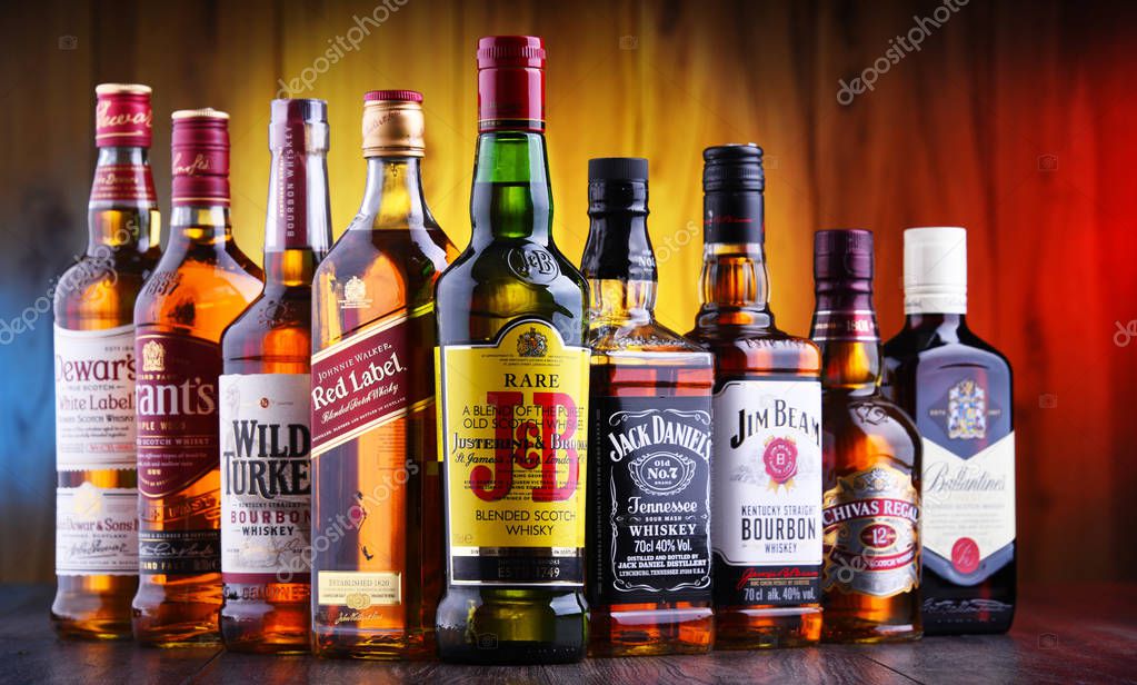 POZNAN, POLAND - JUL 5, 2019: Bottles of several global whiskey brands, the most popular liquor in the world.