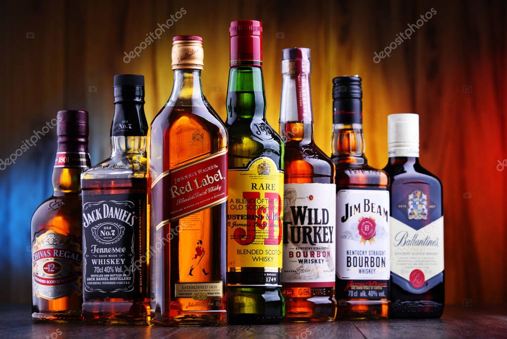 POZNAN, POLAND - JUL 5, 2019: Bottles of several global whiskey brands, the most popular liquor in the world.