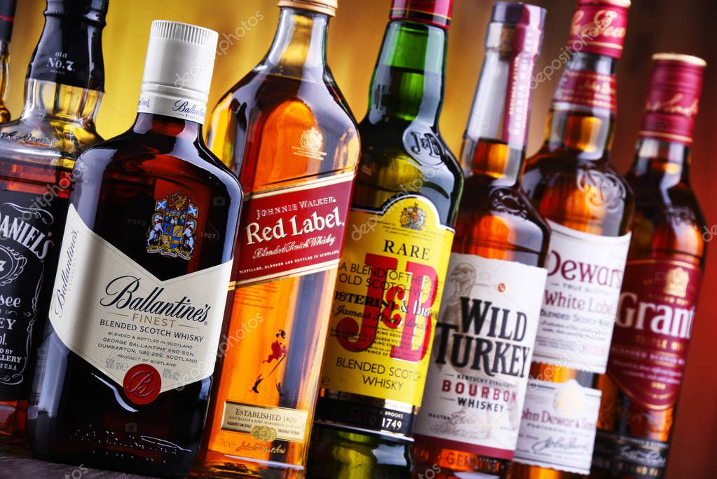 POZNAN, POLAND - JUL 5, 2019: Bottles of several global whiskey brands, the most popular liquor in the world.