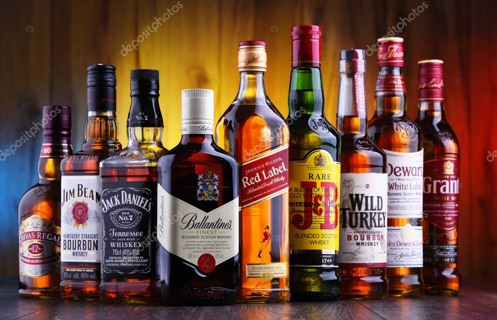 POZNAN, POLAND - JUL 5, 2019: Bottles of several global whiskey brands, the most popular liquor in the world.