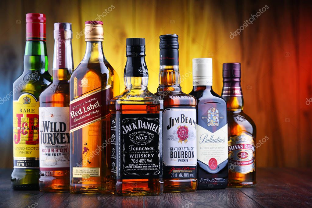 POZNAN, POLAND - JUL 5, 2019: Bottles of several global whiskey brands, the most popular liquor in the world.