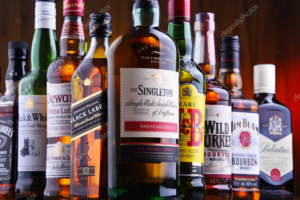 POZNAN, POLAND - JUL 5, 2019: Bottles of several global whiskey brands, the most popular liquor in the world.