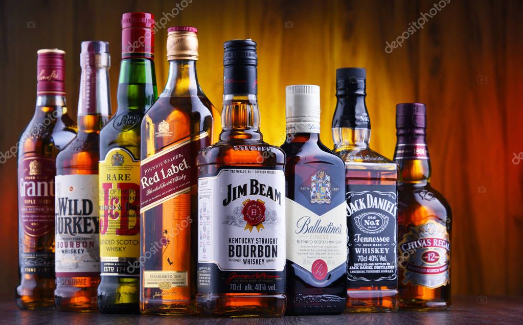 POZNAN, POLAND - JUL 5, 2019: Bottles of several global whiskey brands, the most popular liquor in the world.