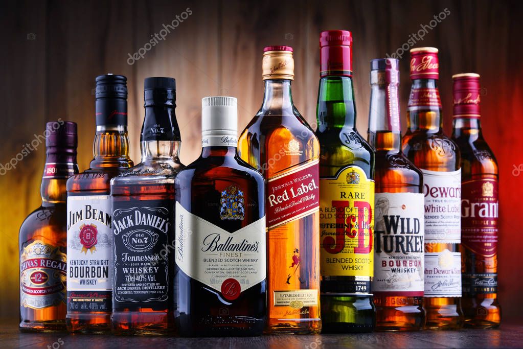 POZNAN, POLAND - JUL 5, 2019: Bottles of several global whiskey brands, the most popular liquor in the world.