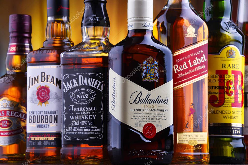 POZNAN, POLAND - JUL 5, 2019: Bottles of several global whiskey brands, the most popular liquor in the world.