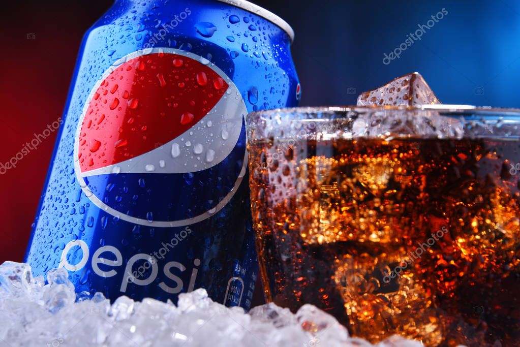 POZNAN, POL - AUG 13, 2019: A can and a glass of Pepsi, a carbonated soft drink produced and manufactured by PepsiCo. The beverage was created and developed in 1893 under the name Brad's Drink