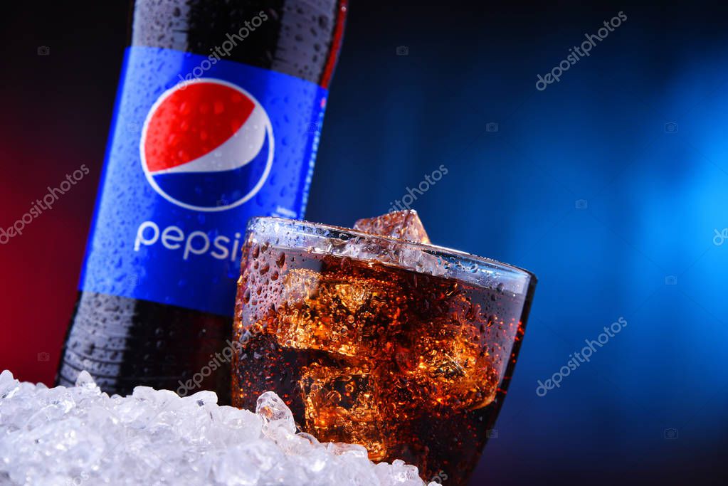 POZNAN, POL - AUG 13, 2019: A bottle and a glass of Pepsi, a carbonated soft drink produced and manufactured by PepsiCo. The beverage was created and developed in 1893 under the name Brad's Drink