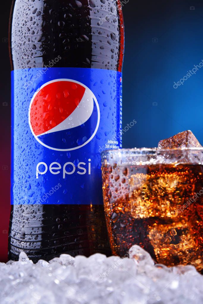 POZNAN, POL - AUG 13, 2019: A bottle and a glass of Pepsi, a carbonated soft drink produced and manufactured by PepsiCo. The beverage was created and developed in 1893 under the name Brad's Drink