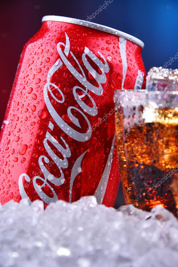 POZNAN, POL - AUG 13, 2019: A glass and a can of Coca-Cola, a carbonated soft drink manufactured by The Coca-Cola Company headquartered in Atlanta, Georgia, USA