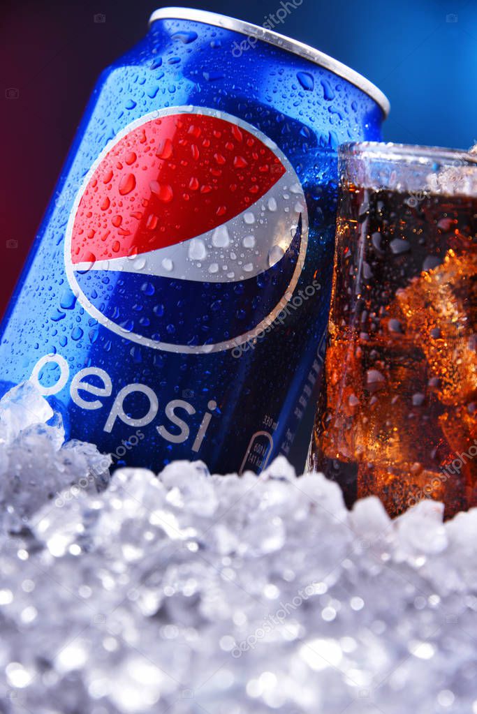 POZNAN, POL - AUG 13, 2019: A can and a glass of Pepsi, a carbonated soft drink produced and manufactured by PepsiCo. The beverage was created and developed in 1893 under the name Brad's Drink