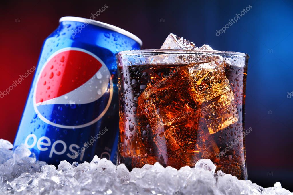 POZNAN, POL - AUG 13, 2019: A can and a glass of Pepsi, a carbonated soft drink produced and manufactured by PepsiCo. The beverage was created and developed in 1893 under the name Brad's Drink