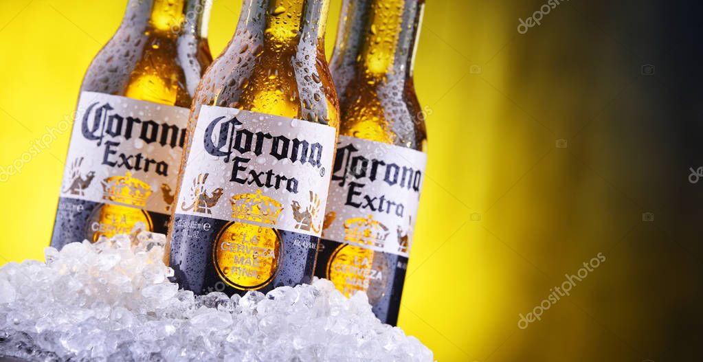 POZNAN, POL - AUG 22, 2019: Bottles of Corona Extra, one of the top-selling beers worldwide, a pale lager produced by Cerveceria Modelo in Mexico