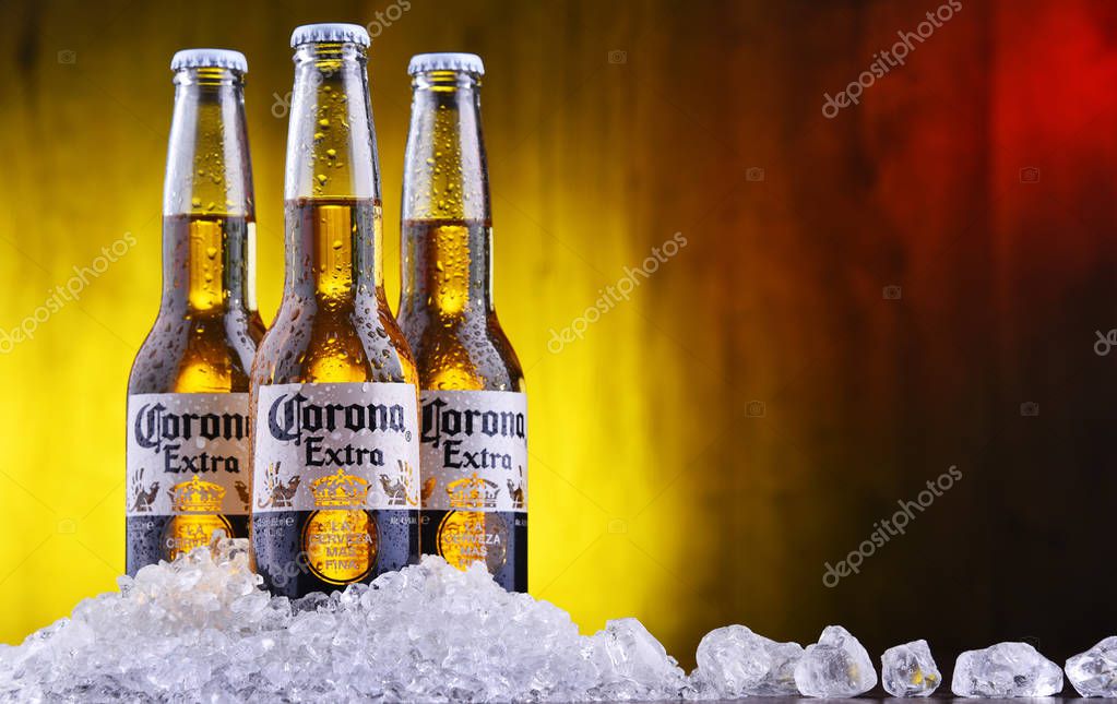 POZNAN, POL - AUG 22, 2019: Bottles of Corona Extra, one of the top-selling beers worldwide, a pale lager produced by Cerveceria Modelo in Mexico