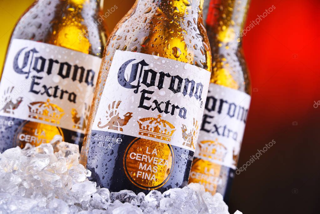 POZNAN, POL - AUG 22, 2019: Bottles of Corona Extra, one of the top-selling beers worldwide, a pale lager produced by Cerveceria Modelo in Mexico