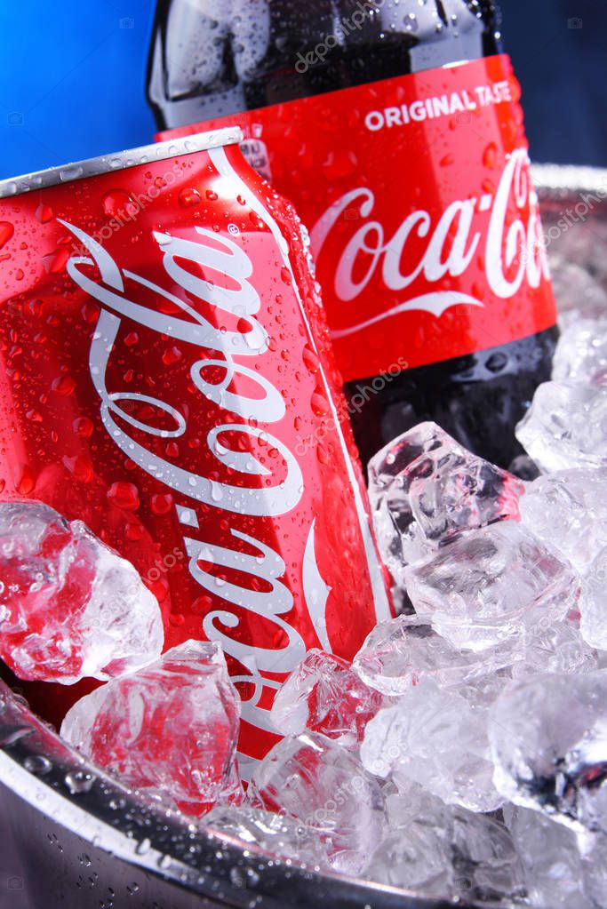 POZNAN, POL - SEP 5, 2019: Bottle and can of Coca-Cola, a carbonated soft drink manufactured by The Coca-Cola Company headquartered in Atlanta, Georgia, USA