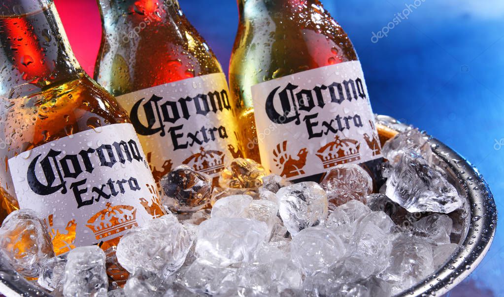 POZNAN, POL - SEP 5, 2019: Bottles of Corona Extra, one of the top-selling beers worldwide, a pale lager produced by Cerveceria Modelo in Mexico
