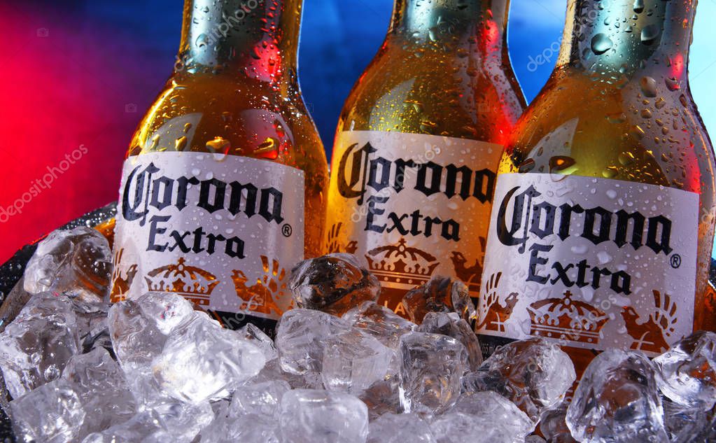 POZNAN, POL - SEP 5, 2019: Bottles of Corona Extra, one of the top-selling beers worldwide, a pale lager produced by Cerveceria Modelo in Mexico