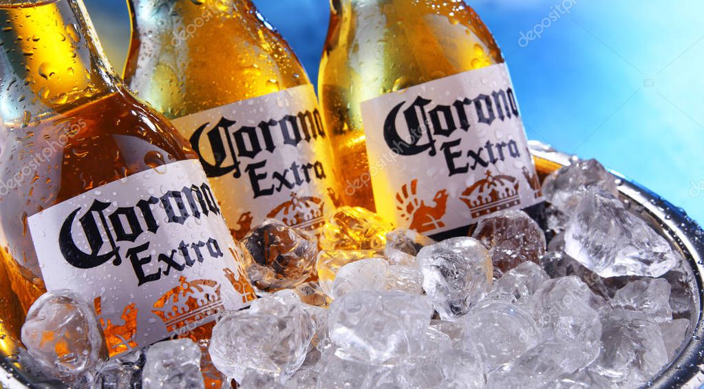 POZNAN, POL - SEP 5, 2019: Bottles of Corona Extra, one of the top-selling beers worldwide, a pale lager produced by Cerveceria Modelo in Mexico