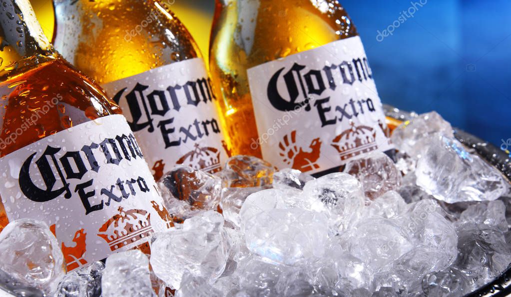 POZNAN, POL - SEP 5, 2019: Bottles of Corona Extra, one of the top-selling beers worldwide, a pale lager produced by Cerveceria Modelo in Mexico