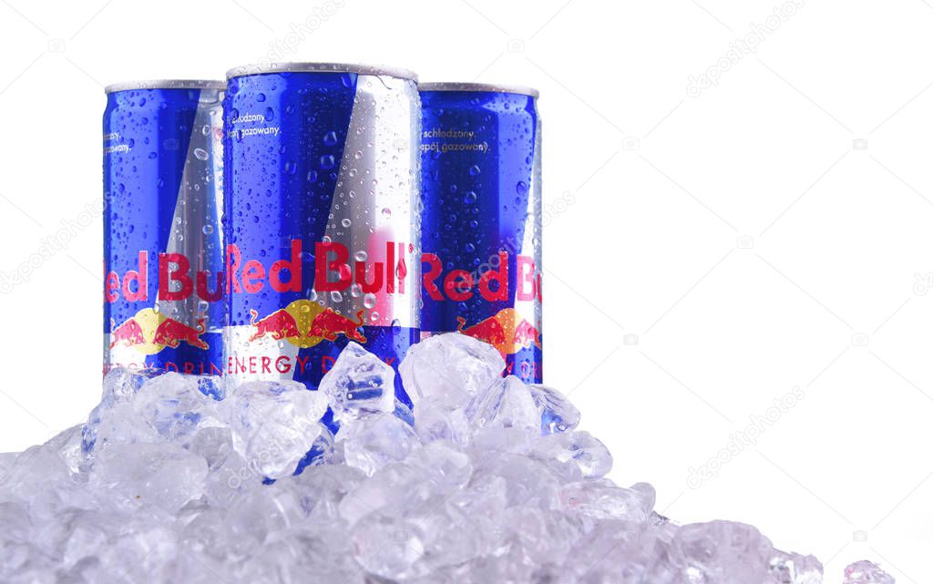 POZNAN, POL - OCT 23, 2019: Cans of Red Bull, an energy drink sold by Red Bull GmbH, an Austrian company created in 1987