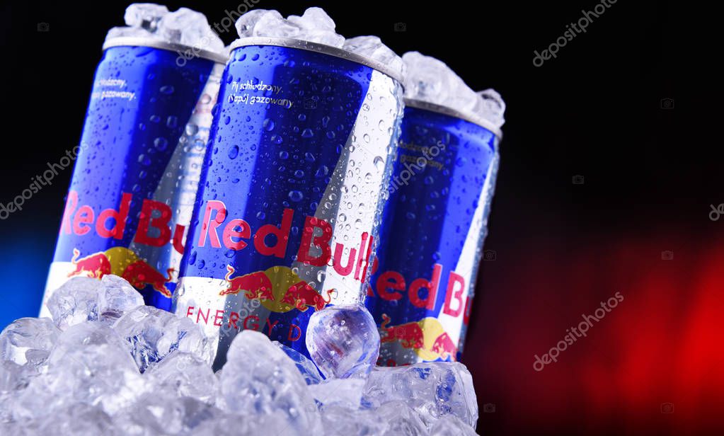 POZNAN, POL - OCT 23, 2019: Cans of Red Bull, an energy drink sold by Red Bull GmbH, an Austrian company created in 1987