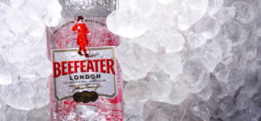 POZNAN, POL - MAY 28, 2020: Bottle of Beefeater Gin, a brand of gin owned by Pernod Ricard and bottled and distributed in the UK, by the company of James Burrough. clipart
