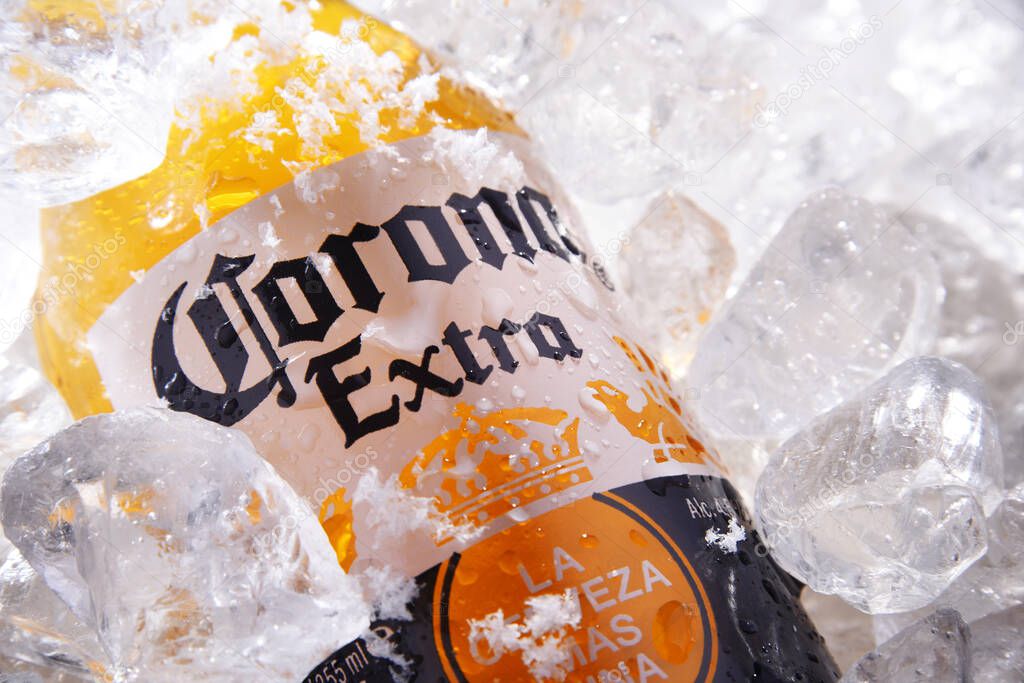 POZNAN, POL - MAY 22, 2020: Bottle of Corona Extra, one of the top-selling beers worldwide, a pale lager produced by Cerveceria Modelo in Mexico