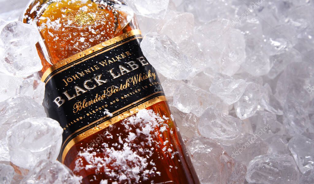 POZNAN, POL - MAY 28, 2020: Bottle of Johnnie Walker, the most widely distributed brand of blended Scotch whisky in the world with sales of over 130 million bottles a year.