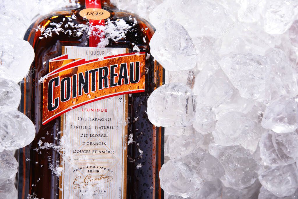 POZNAN, POL - MAY 28, 2020: Bottle of Cointreau, a brand of French triple sec (an orange-flavoured liqueur); great component of several well-known cocktails, also drunk as an aperitif and digestif