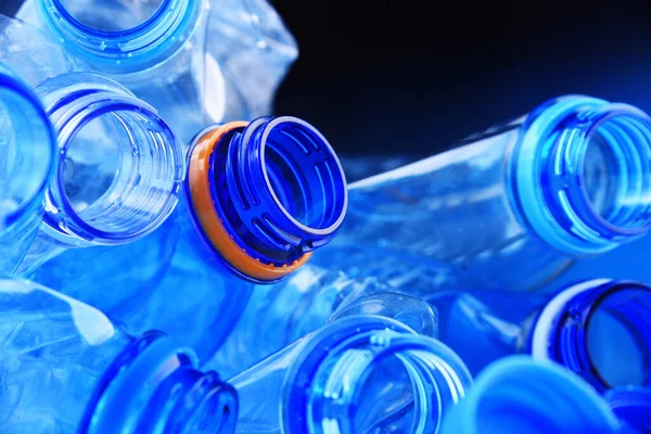 Composition with empty mineral water bottles. Plastic waste