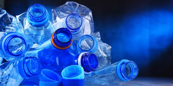 Composition with empty mineral water bottles. Plastic waste