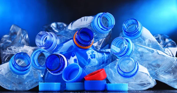 Composition with empty mineral water bottles. Plastic waste