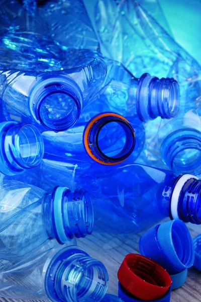 Composition with empty mineral water bottles. Plastic waste