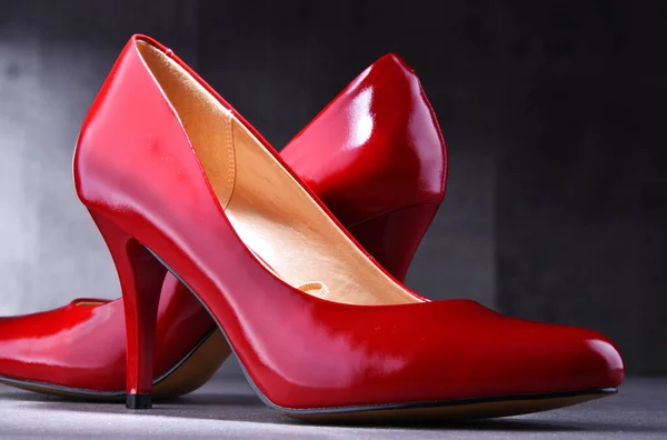 stock image Composition with a pair of red high heel shoes.