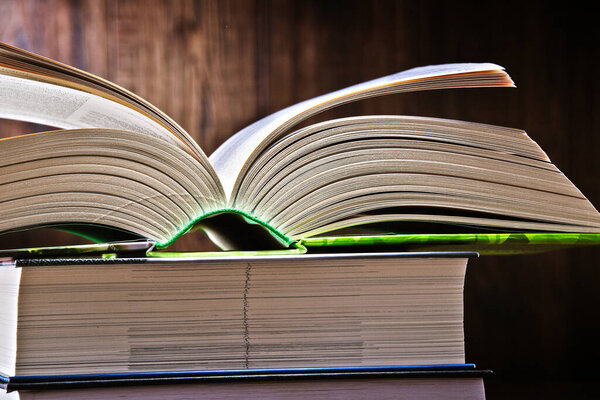 Composition with open book on the table.