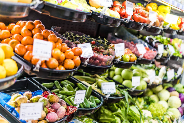 Fresh vegetables and fruits put up for sale in supermarket.
