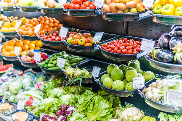 Fresh vegetables and fruits put up for sale in supermarket.