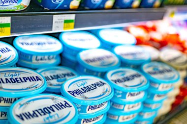 MUSCAT, OMAN - MAR 14, 2024: Philadelphia Cream Cheese put out for sale in a commercial refrigerator in a supermarket