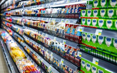 MUSCAT, OMAN - MAR 14, 2024: Dairy products put out for sale in a commercial refrigerator in a supermarket