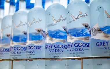 DUBAI, UAE - MAR 21, 2024: Bottles of Grey Goose vodka on a store shelf