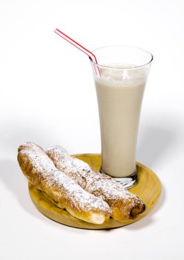 Horchata is a drink, made with the juice of tigernuts and sugar. Native from Valencia ? Spain, it is a refreshing drink, often accompanied with long thin buns called fartons. clipart