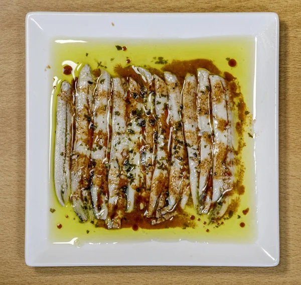 a pile of anchovies in vinegar in oil, ration type tapa typical of Spain