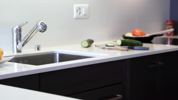Modern kitchen design of the interior kitchen cabinets and modern kitchen countertop. Counter is made of the natural stone granite or quartz and cabinet doors are made of the natural wood.