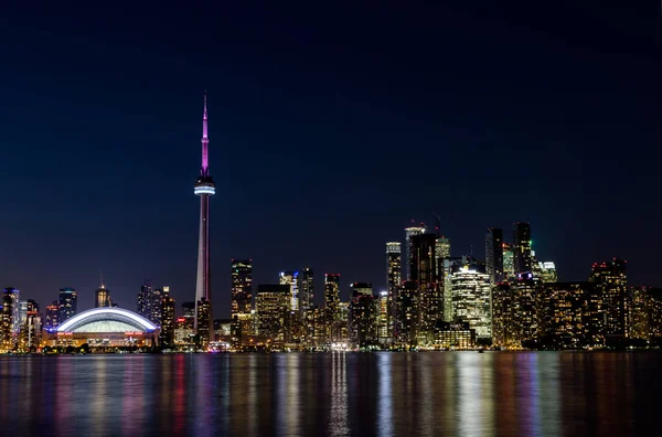 Night View of Downtown Toronto from Toronto Islands with the Lake Ontario, Canada.