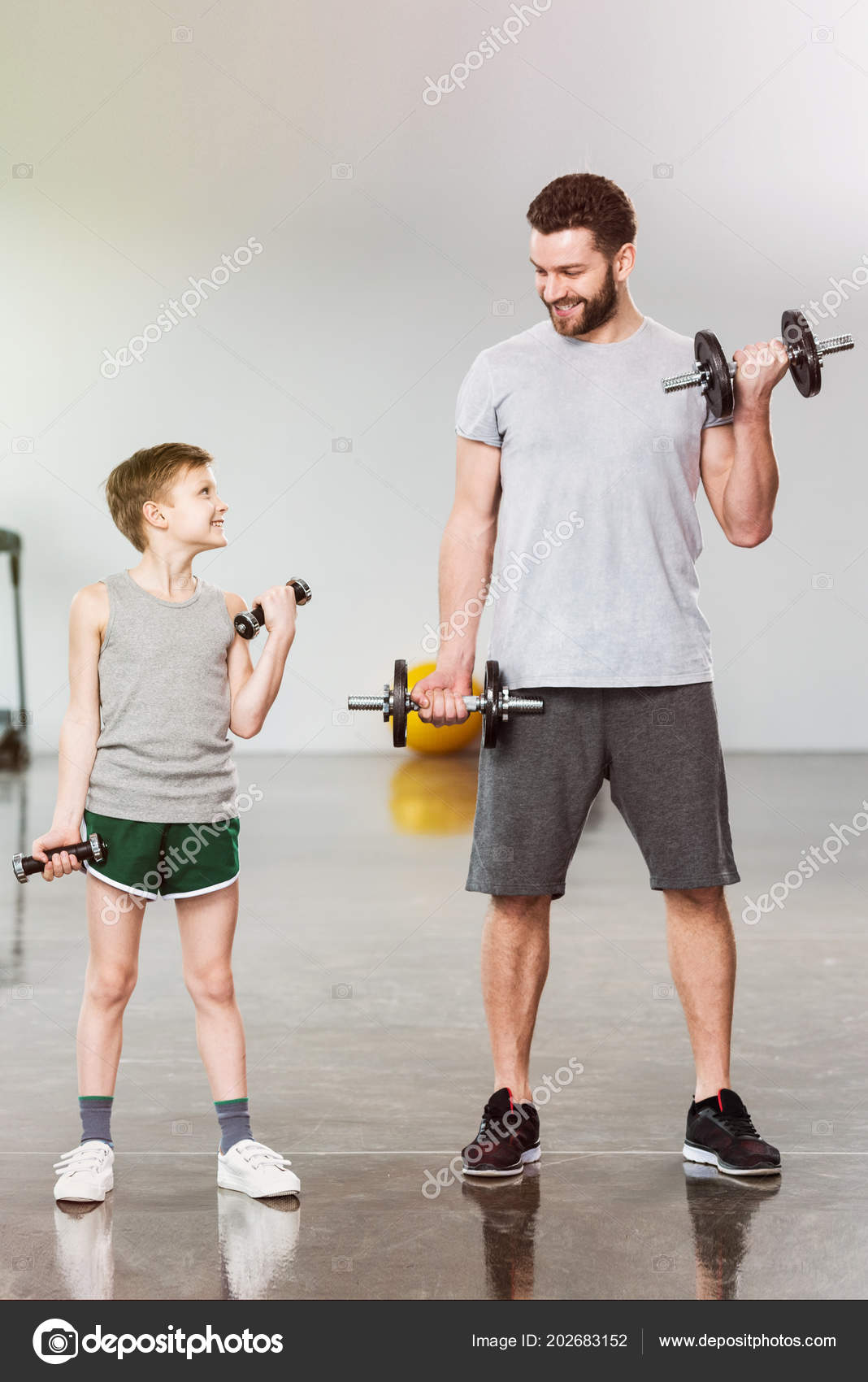 Adorable Little Kid Training Dumbbells Together Father Fitness Center