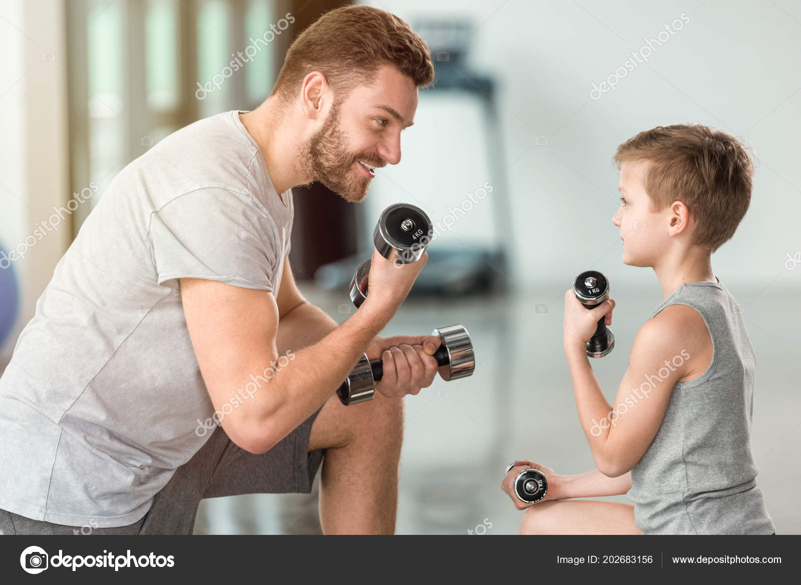 Little Kid Training Dumbbells Together Father Fitness Center Stock