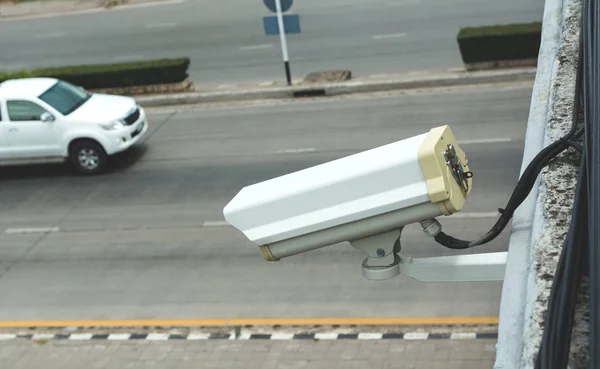 Closed Circuit Television camera. Closed circuit television recording on road background.