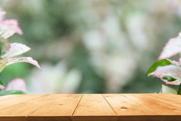 Macro of Sweet flower with wooden table. Close up white flowers on nature background.